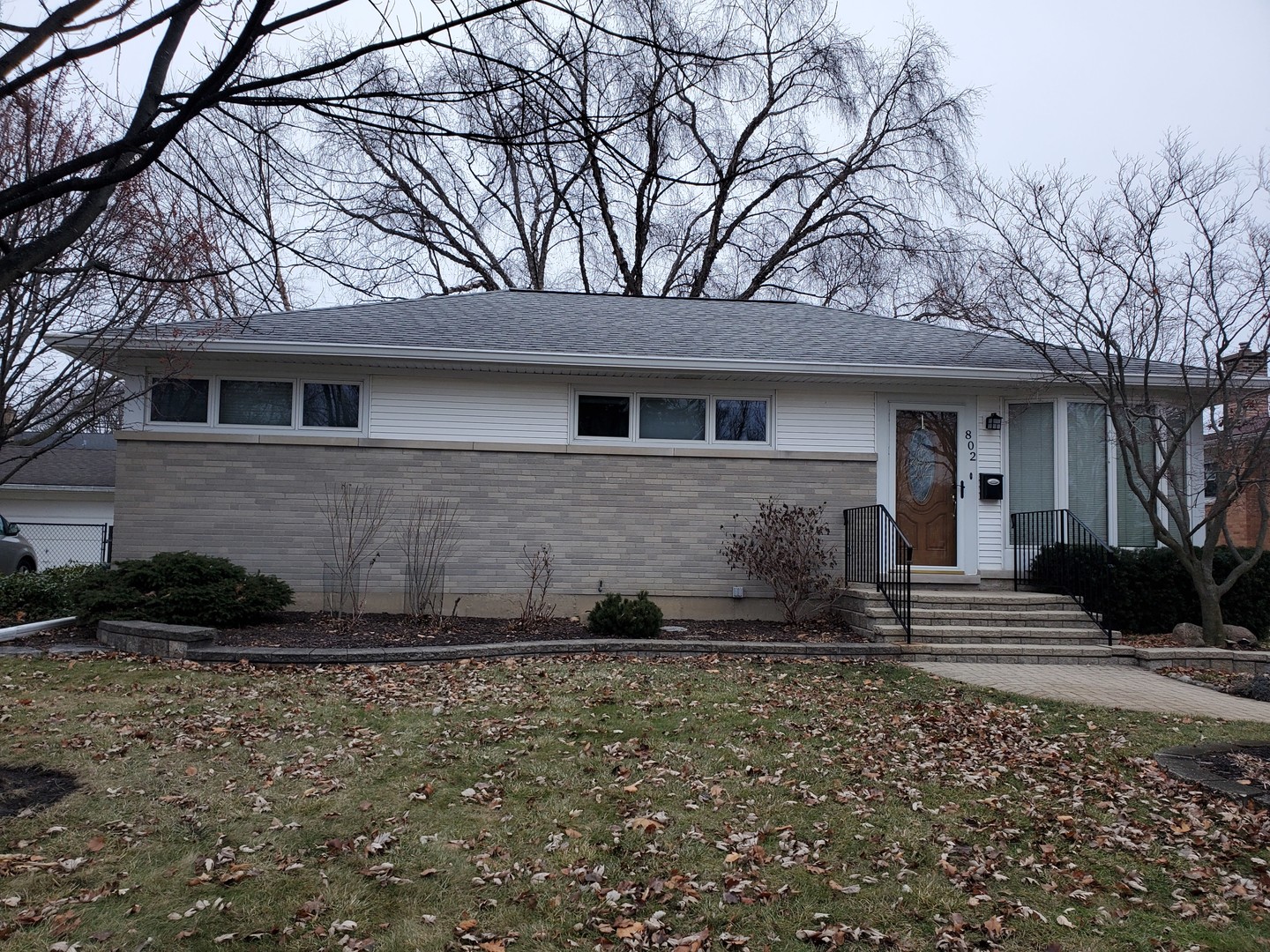 802 West Busse Avenue Mount Prospect, IL 60056 - Photo 4 of 9 a front view of a house with a yard