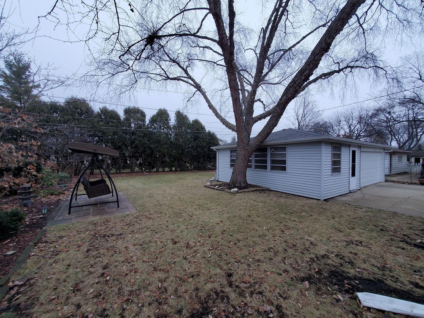 802 West Busse Avenue Mount Prospect, IL 60056 - Photo 6 of 9 a view of a house with a yard
