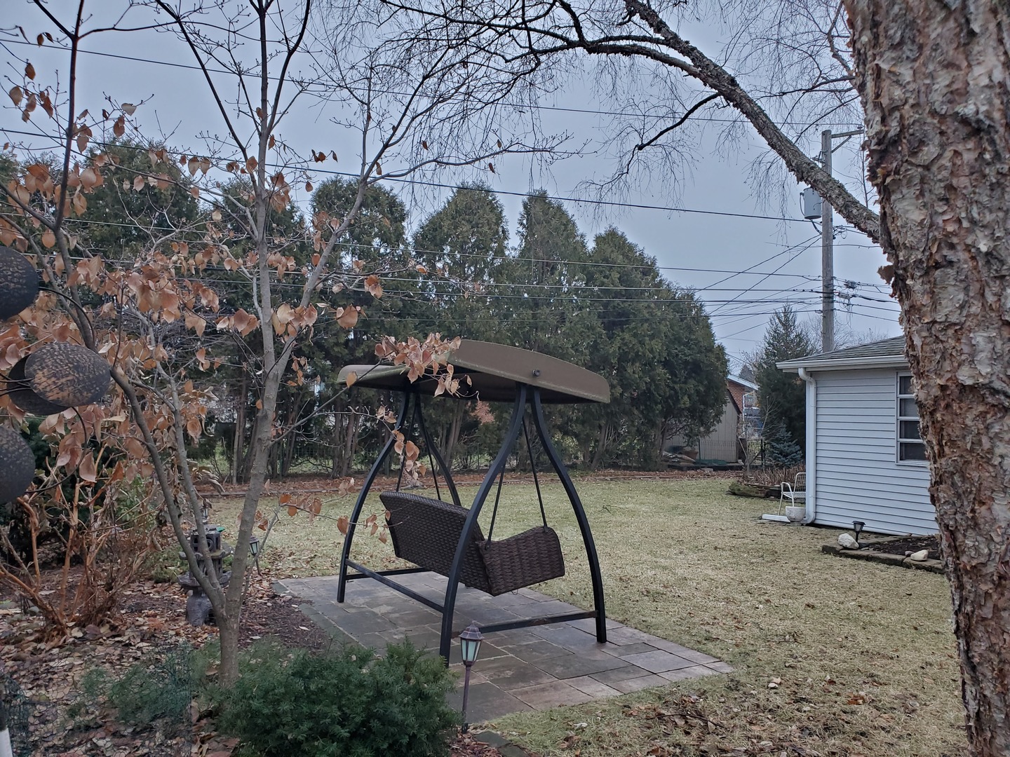 802 West Busse Avenue Mount Prospect, IL 60056 - Photo 7 of 9 a view of a backyard with a table and chairs