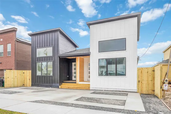 a view of a brick house with a large windows