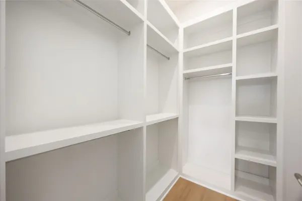 a view of an empty walk in closet