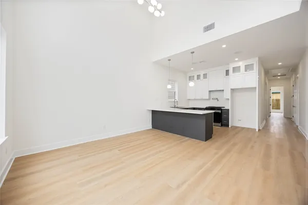 a view of kitchen cabinet and microwave