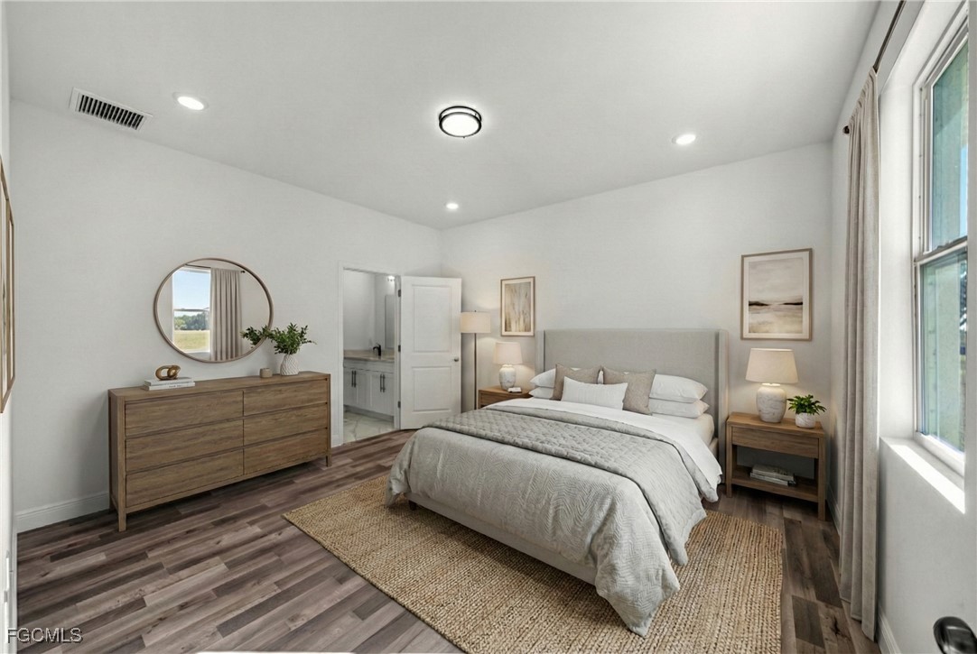 1252 Edna Street East Lehigh Acres, FL 33974 - Photo 11 of 25 a room with a bed and a dresser