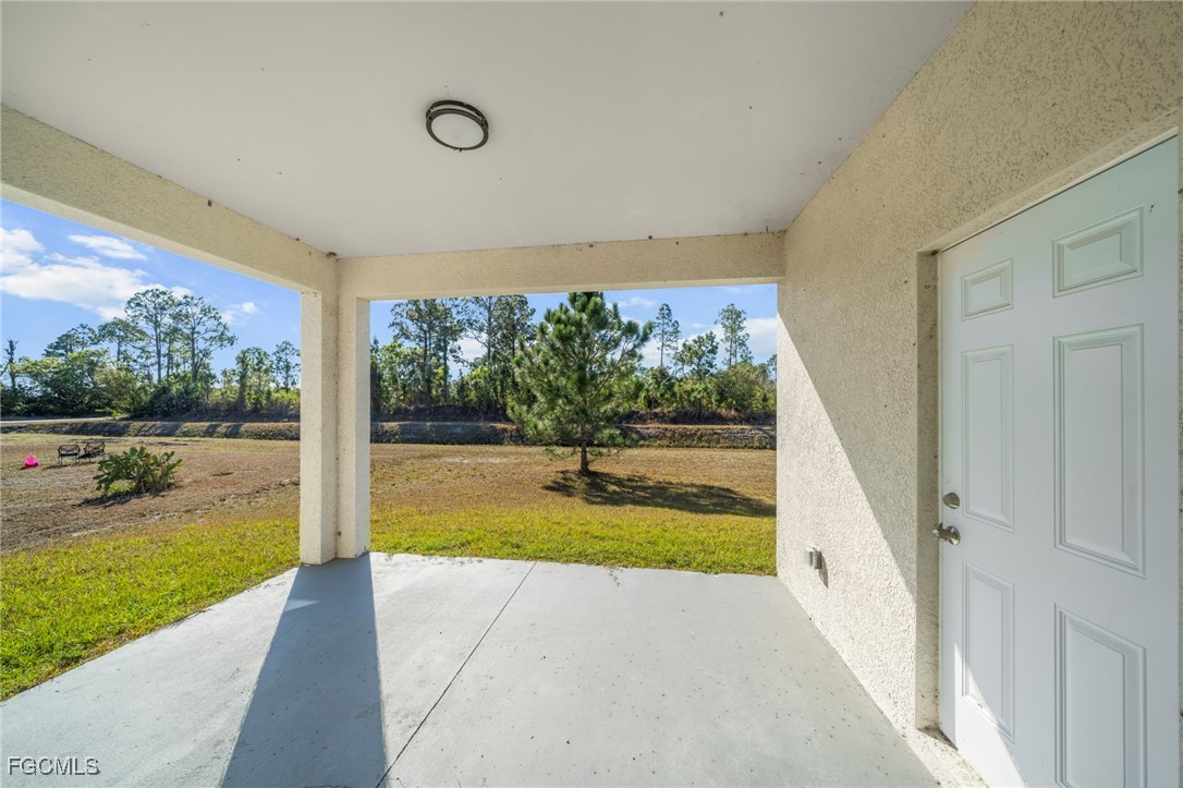 1252 Edna Street East Lehigh Acres, FL 33974 - Photo 19 of 25 a view of swimming pool from a balcony