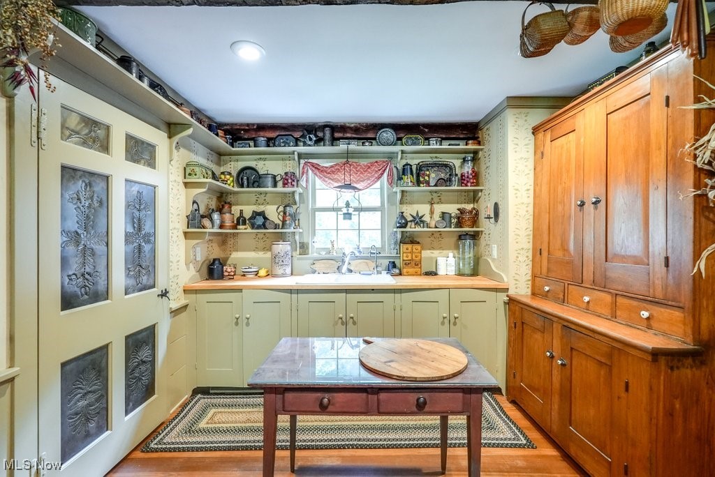 9699 Acme Road Rittman, OH 44270 - Photo 8 of 36 Kitchen featuring light hardwood / wood-style floors and sink