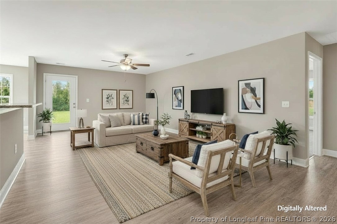 756 Jordan Road Autryville, NC 28318 - Photo 12 of 34 a living room with furniture and a flat screen tv