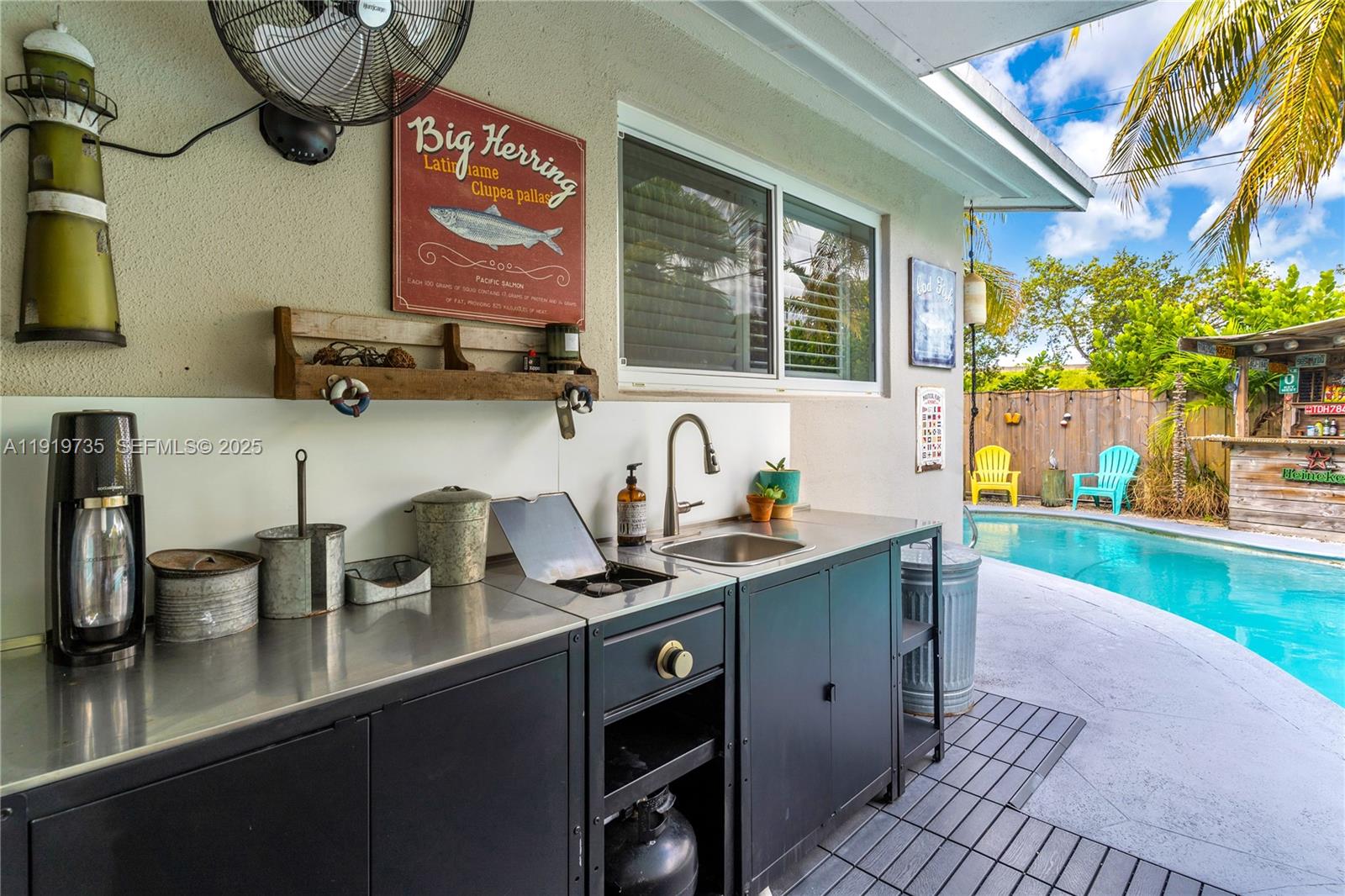 20130 Southwest 106th Court Cutler Bay, FL 33189 - Photo 22 of 42 a kitchen with stainless steel appliances a sink a stove and a wooden floor