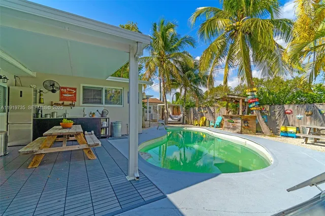 a backyard of a house with seating space