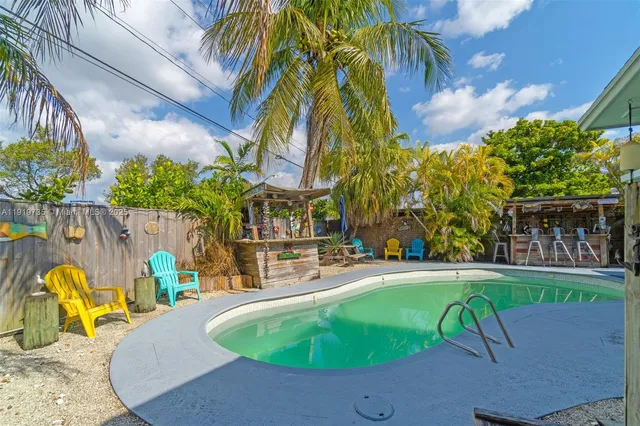 a wooden bench sitting in front of a building