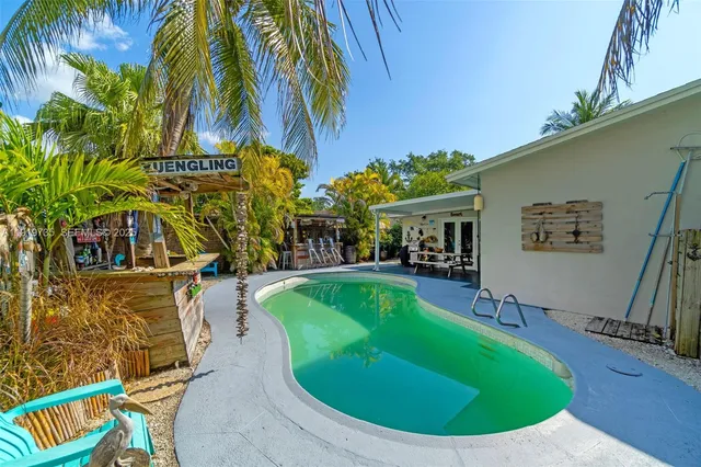 a view of a swimming pool with a patio