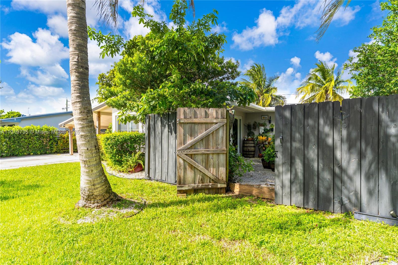 20130 Southwest 106th Court Cutler Bay, FL 33189 - Photo 3 of 42 a view of a backyard with a tree