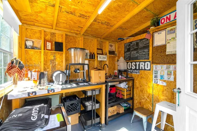 a utility room with multiple furniture and a window