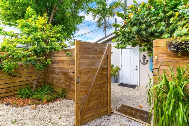 a view of a chairs and table in a entryway