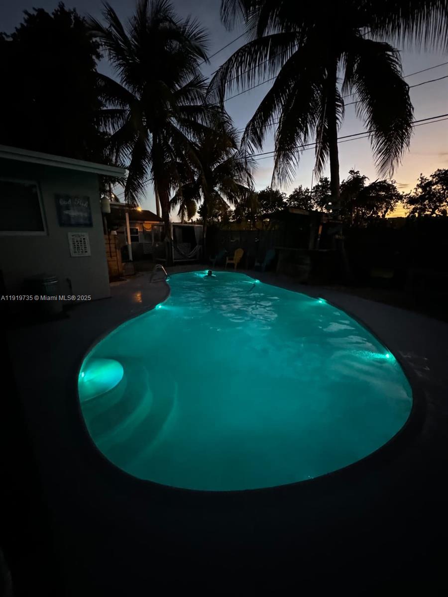 20130 Southwest 106th Court Cutler Bay, FL 33189 - Photo 41 of 42 a view of a swimming pool with an outdoor space