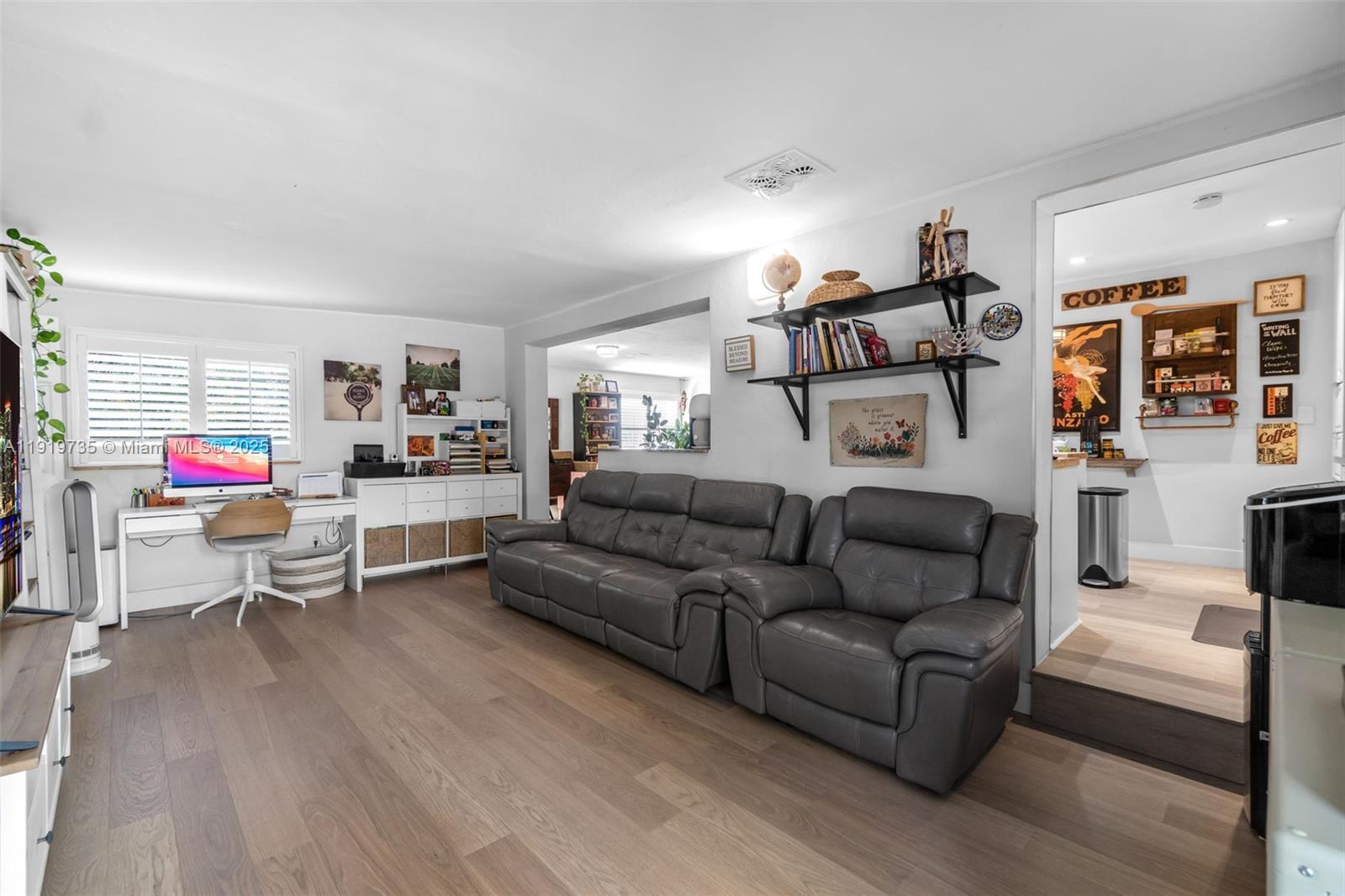 20130 Southwest 106th Court Cutler Bay, FL 33189 - Photo 10 of 42 a living room with furniture and a wooden floor