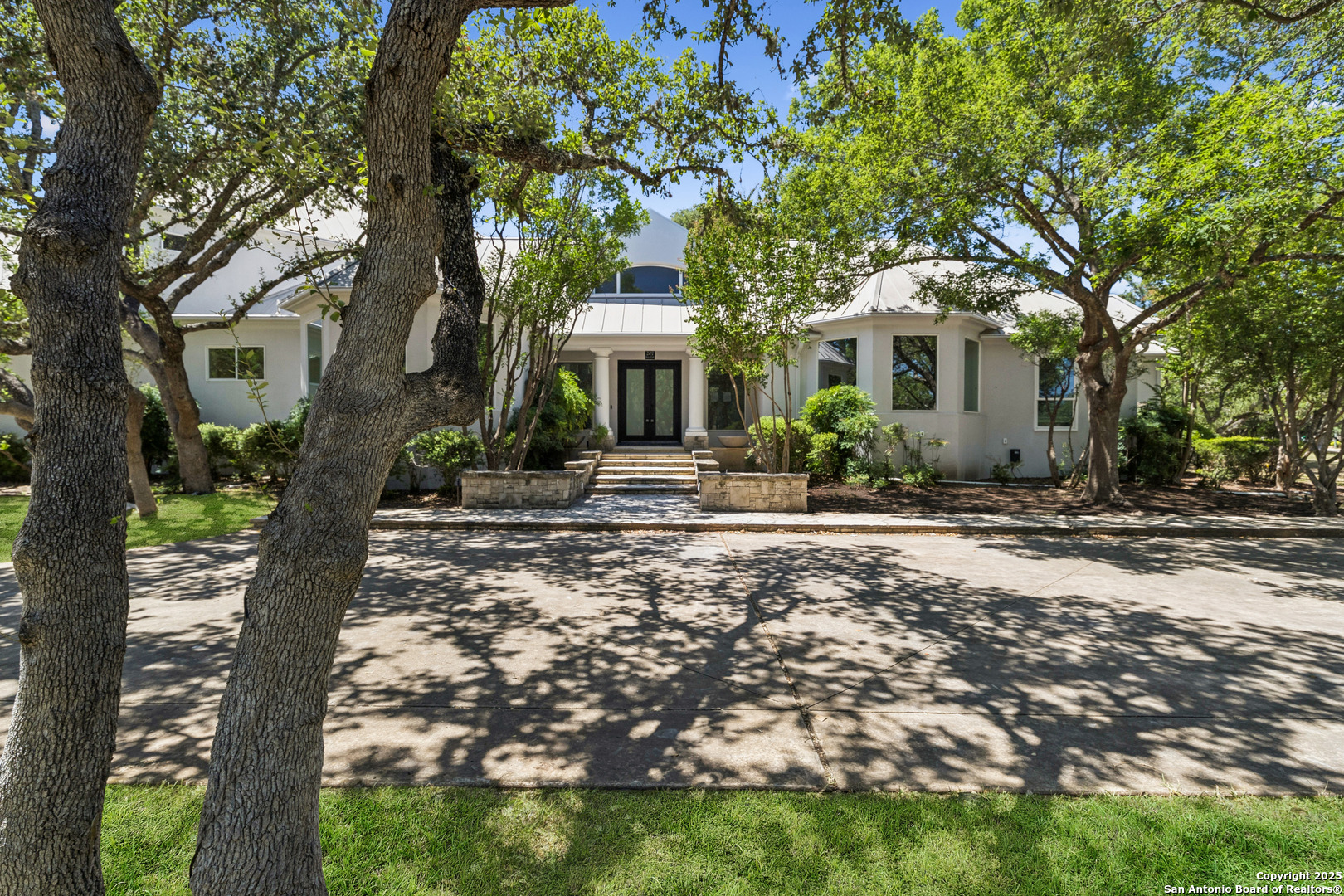 a front view of a house with garden