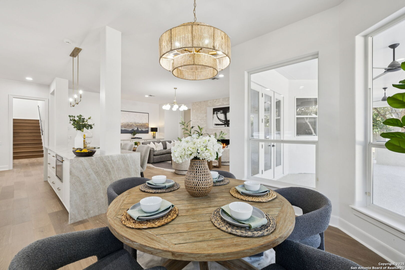 207 Box Oak Shavano Park, TX 78230 - Photo 20 of 50 a view of a dining room with furniture a chandelier and wooden floor