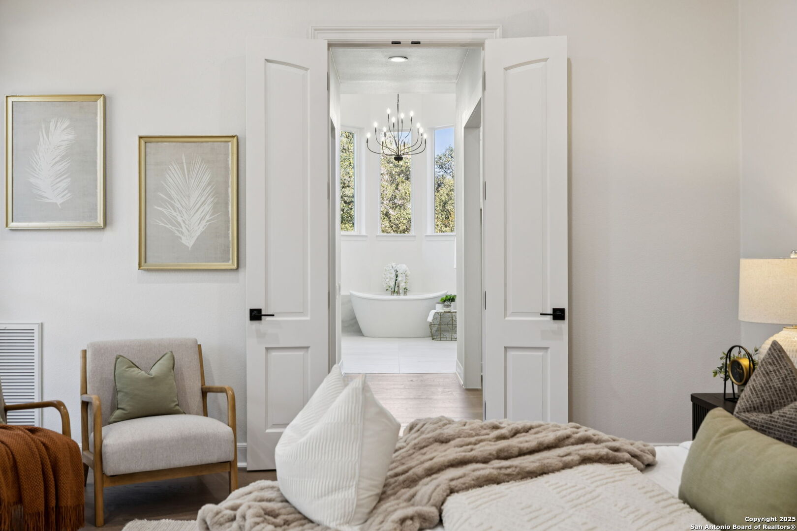 207 Box Oak Shavano Park, TX 78230 - Photo 29 of 50 a bedroom with a bed and wooden floor