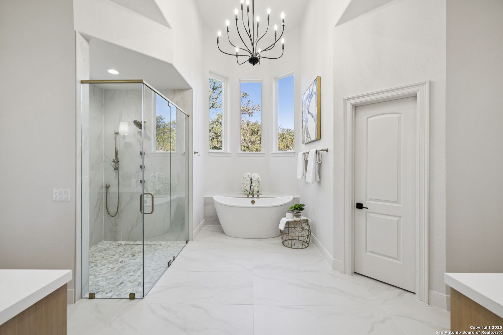 207 Box Oak Shavano Park, TX 78230 - Photo 32 of 50 a bathroom with a sink mirror and a shower