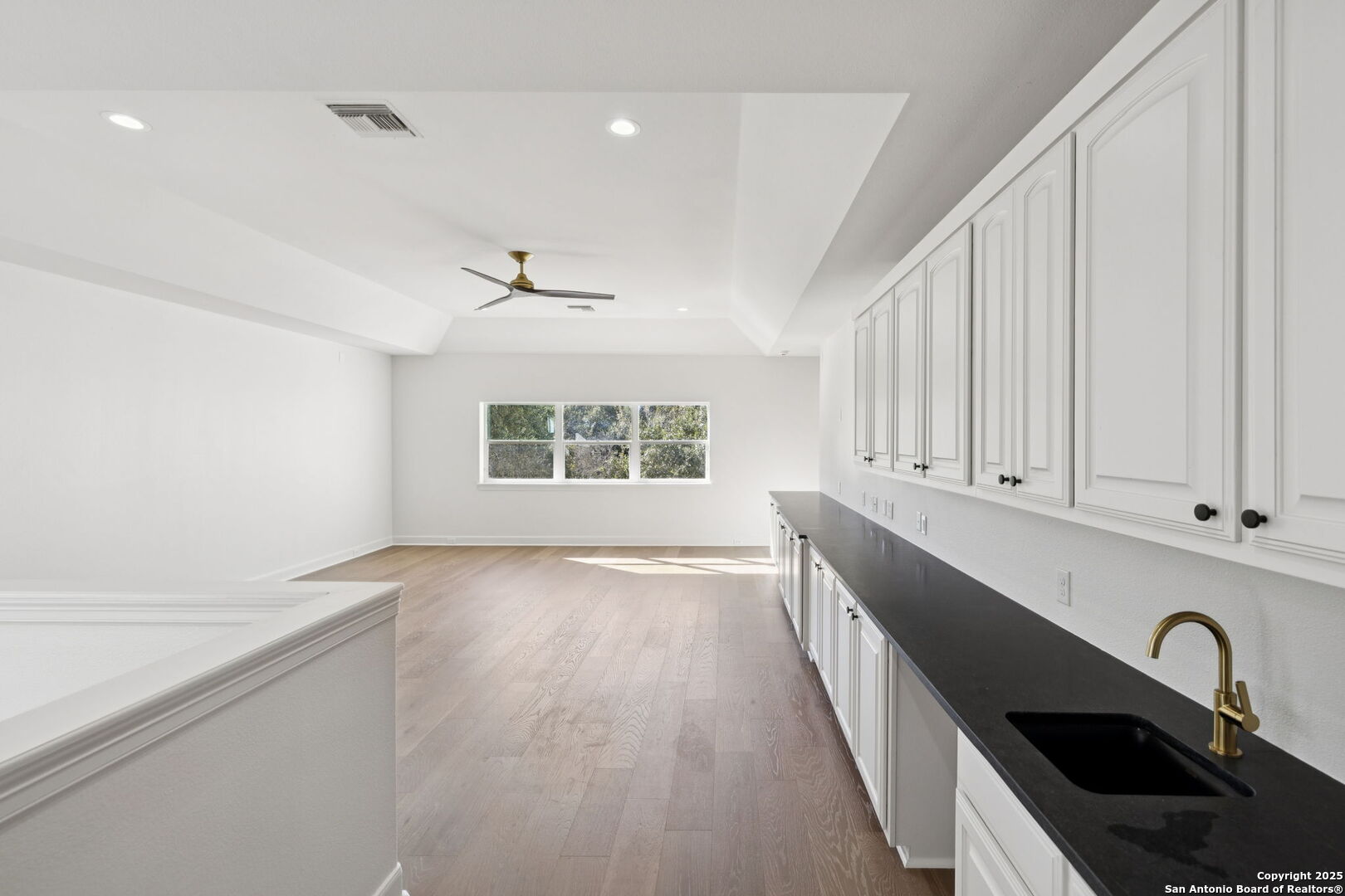 207 Box Oak Shavano Park, TX 78230 - Photo 40 of 50 wooden floor in an empty room with a window