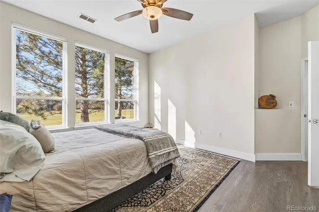a bedroom with a large bed and a window