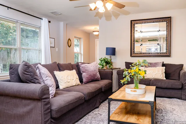 a living room with furniture and a large window