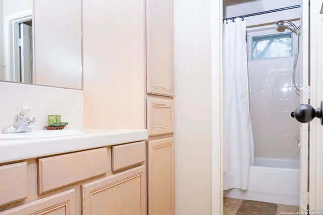 a bedroom with a bed and lamp