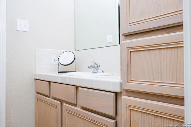 a white toilet sitting next to a bathtub