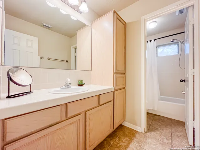 a bedroom with a bed and a view of bathroom
