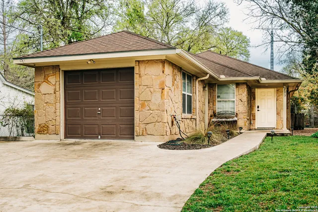 a view of a dining room with furniture and a window