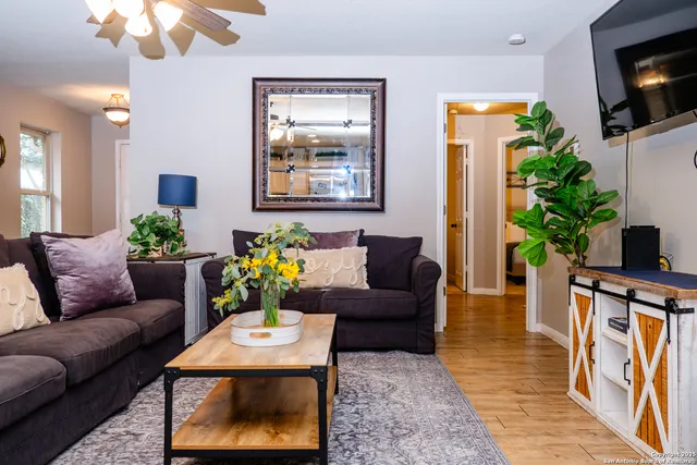 a living room with furniture and a flat screen tv