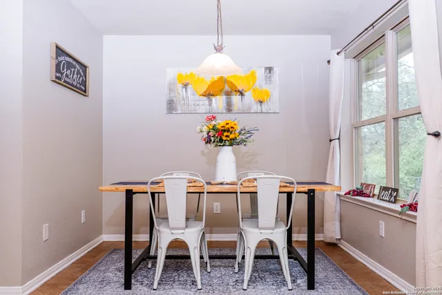 a view of a dining room with furniture window and outside view