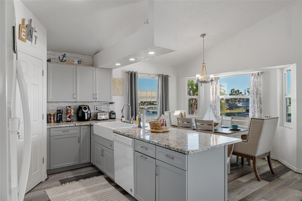 4046 Casa Court Hernando Beach, FL 34607 - Photo 15 of 58 a kitchen with sink cabinets and stove