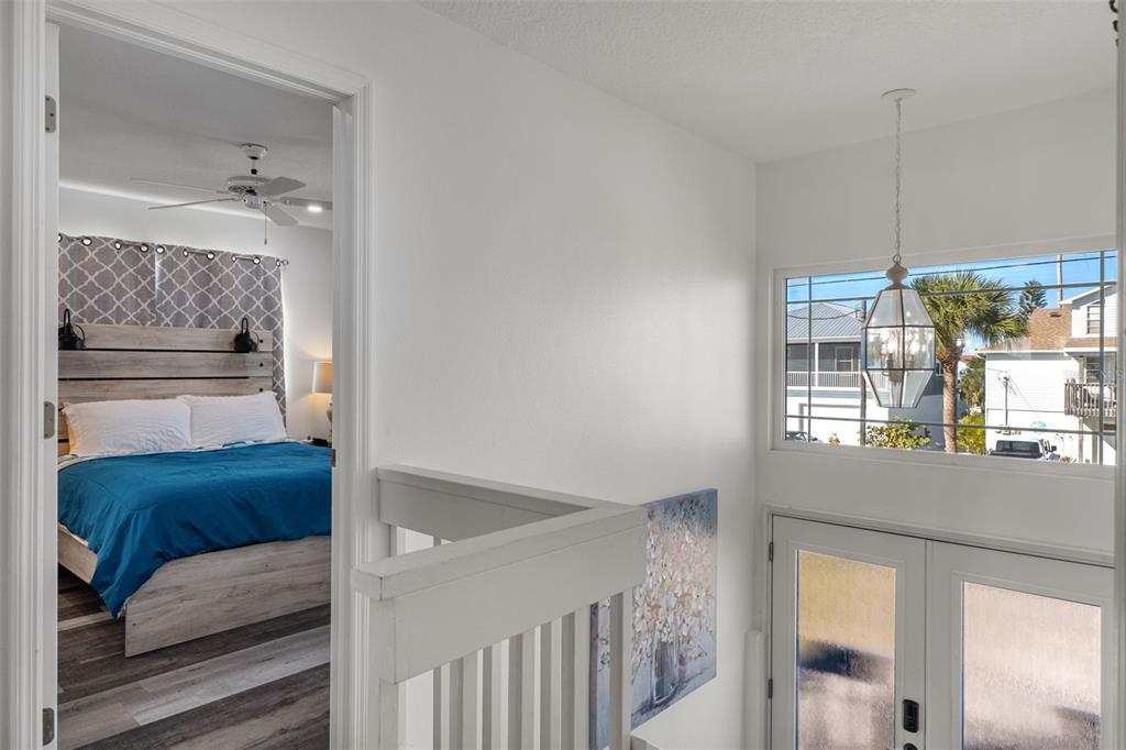 4046 Casa Court Hernando Beach, FL 34607 - Photo 17 of 58 a en suite bathroom with a sink a mirror and a shower