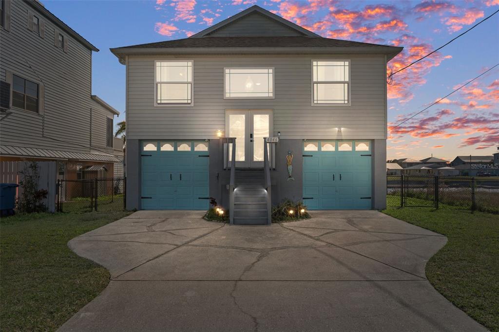 4046 Casa Court Hernando Beach, FL 34607 - Photo 2 of 58 a view of a house with a yard