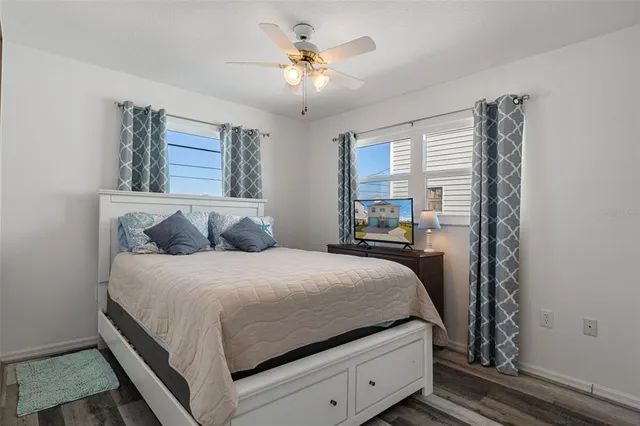 a bathroom with a granite countertop toilet a sink and a mirror