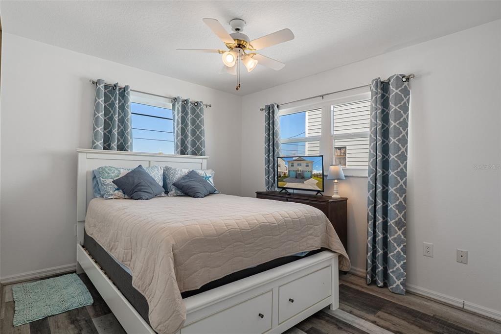 4046 Casa Court Hernando Beach, FL 34607 - Photo 23 of 58 a bedroom with a bed and window