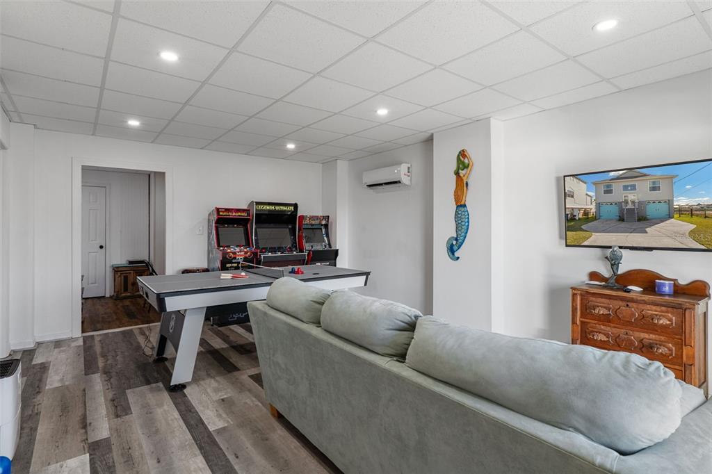 4046 Casa Court Hernando Beach, FL 34607 - Photo 31 of 58 a living room with furniture and a flat screen tv