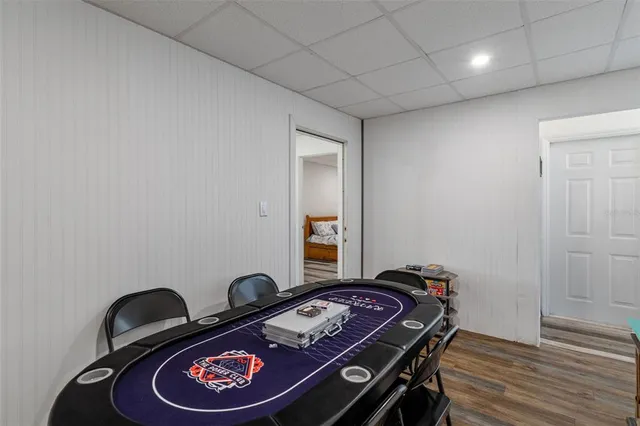 a bed sitting in a room next to a cabinet