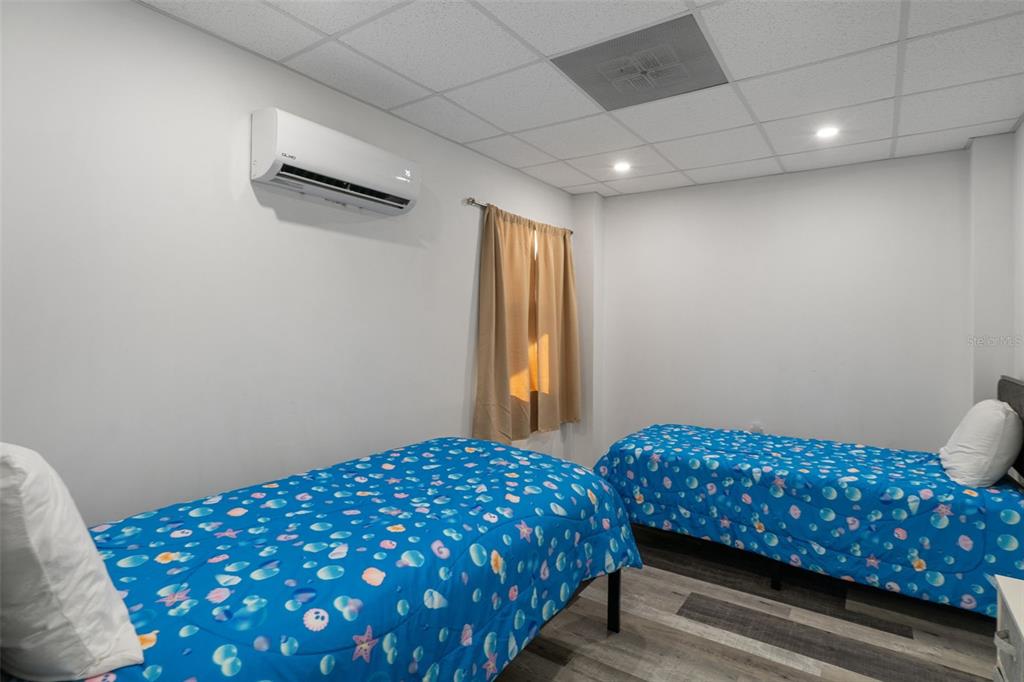 4046 Casa Court Hernando Beach, FL 34607 - Photo 36 of 58 a bedroom with a bed and a window