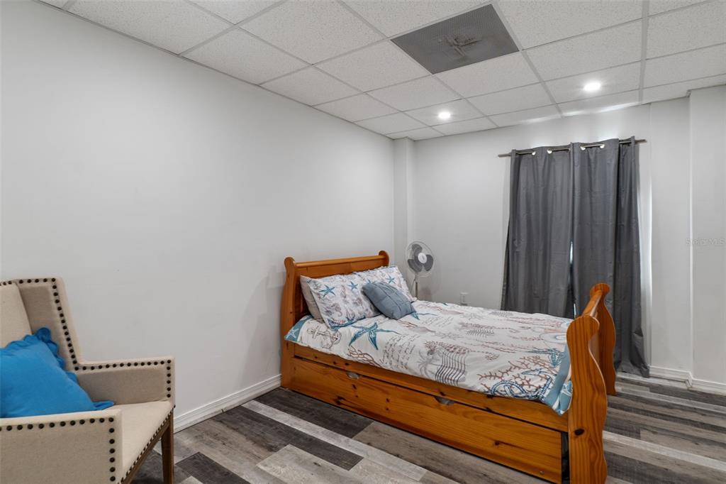 4046 Casa Court Hernando Beach, FL 34607 - Photo 38 of 58 a bed sitting in a room next to a cabinet