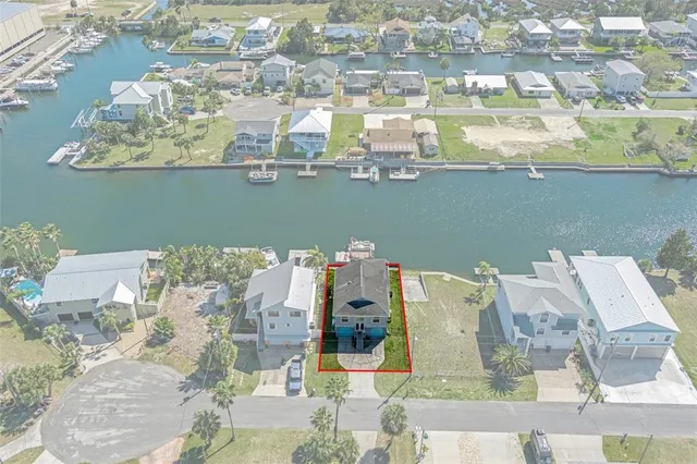 an aerial view of a house with outdoor space