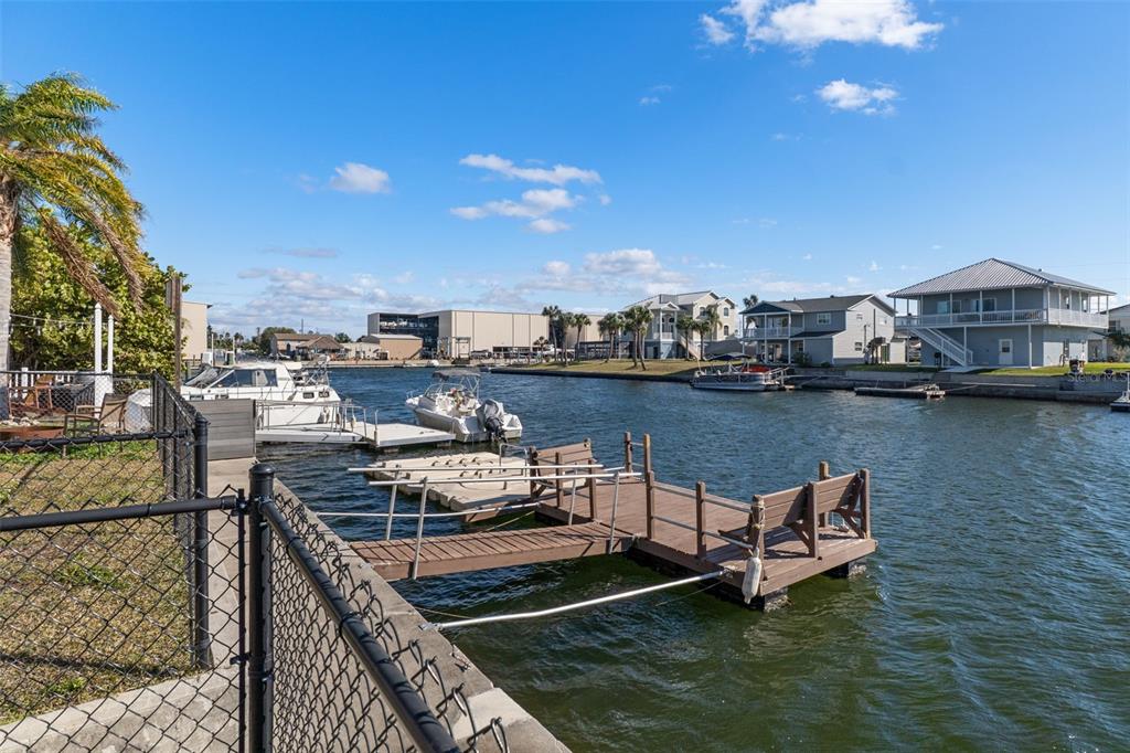 4046 Casa Court Hernando Beach, FL 34607 - Photo 45 of 58 a view of a lake with a table and chairs