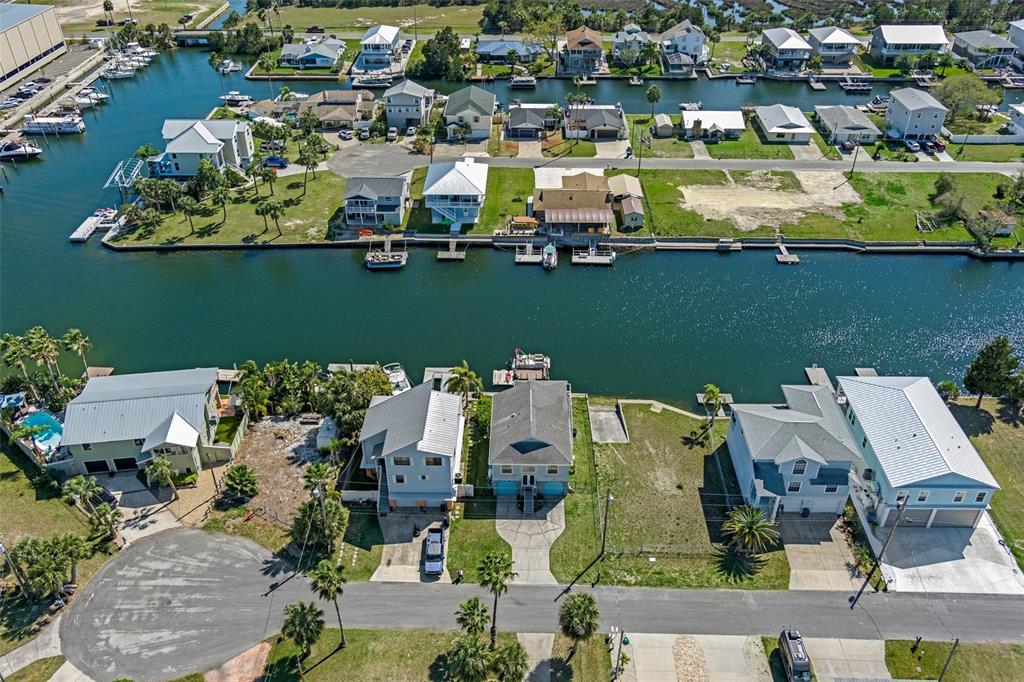4046 Casa Court Hernando Beach, FL 34607 - Photo 46 of 58 an aerial view of a house with a lake view