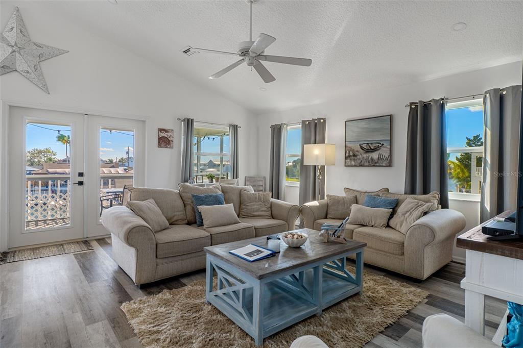 4046 Casa Court Hernando Beach, FL 34607 - Photo 7 of 58 a living room with furniture a rug and a large window