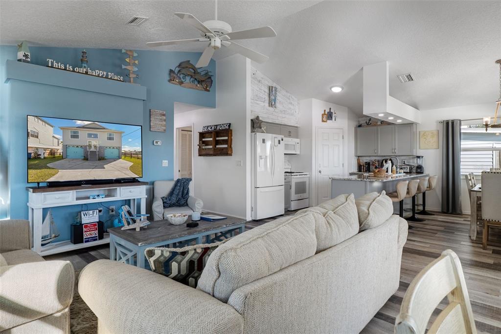 4046 Casa Court Hernando Beach, FL 34607 - Photo 9 of 58 a living room with furniture and a flat screen tv