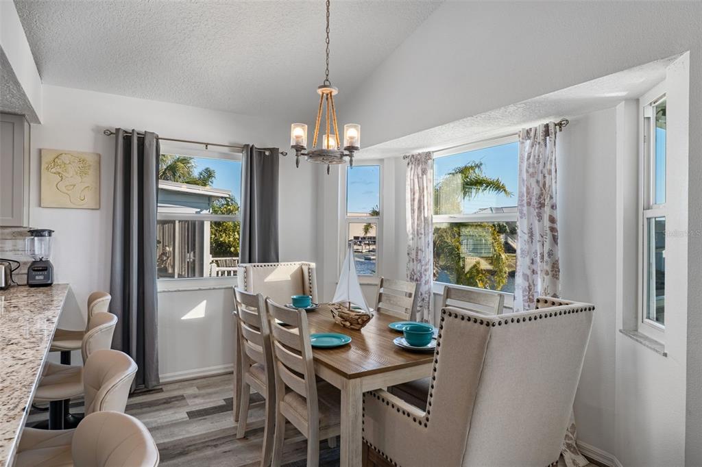 4046 Casa Court Hernando Beach, FL 34607 - Photo 10 of 58 a view of a dining room with furniture and chandelier