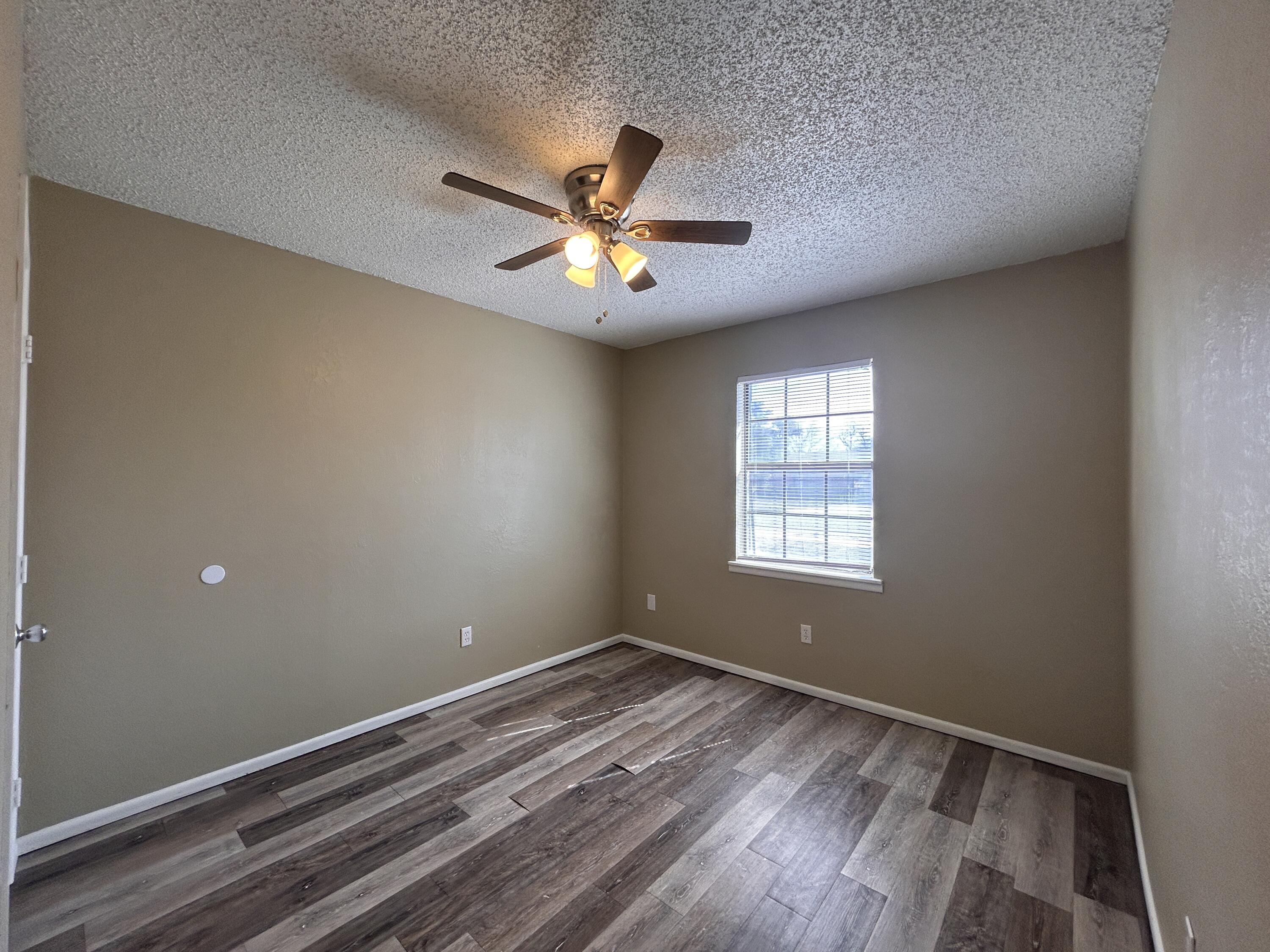 6508 25th Street Lubbock, TX 79407 - Photo 11 of 14 a view of empty room with ceiling fan