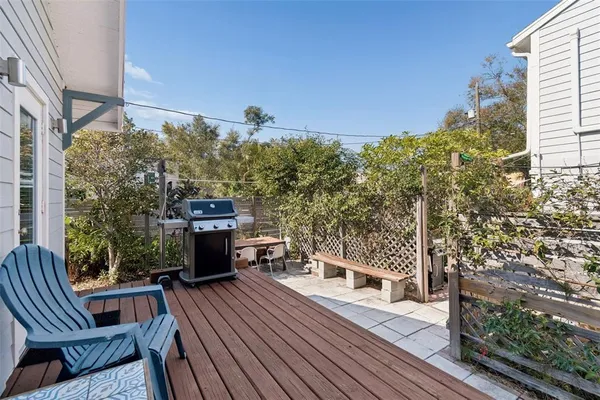 a backyard of a house with outdoor seating