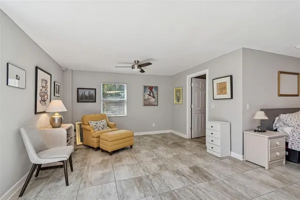 a dining room with furniture window and wooden floor